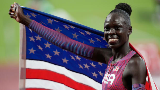 Athing Mu celebrates after winning gold in the women's 800 meters.